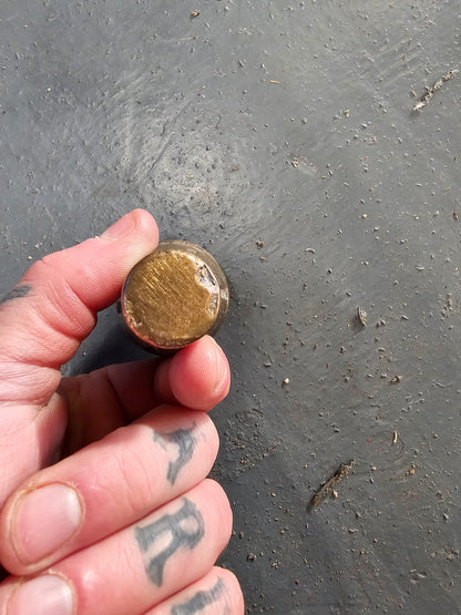 Brass knob. Would make a really nice shifter handle