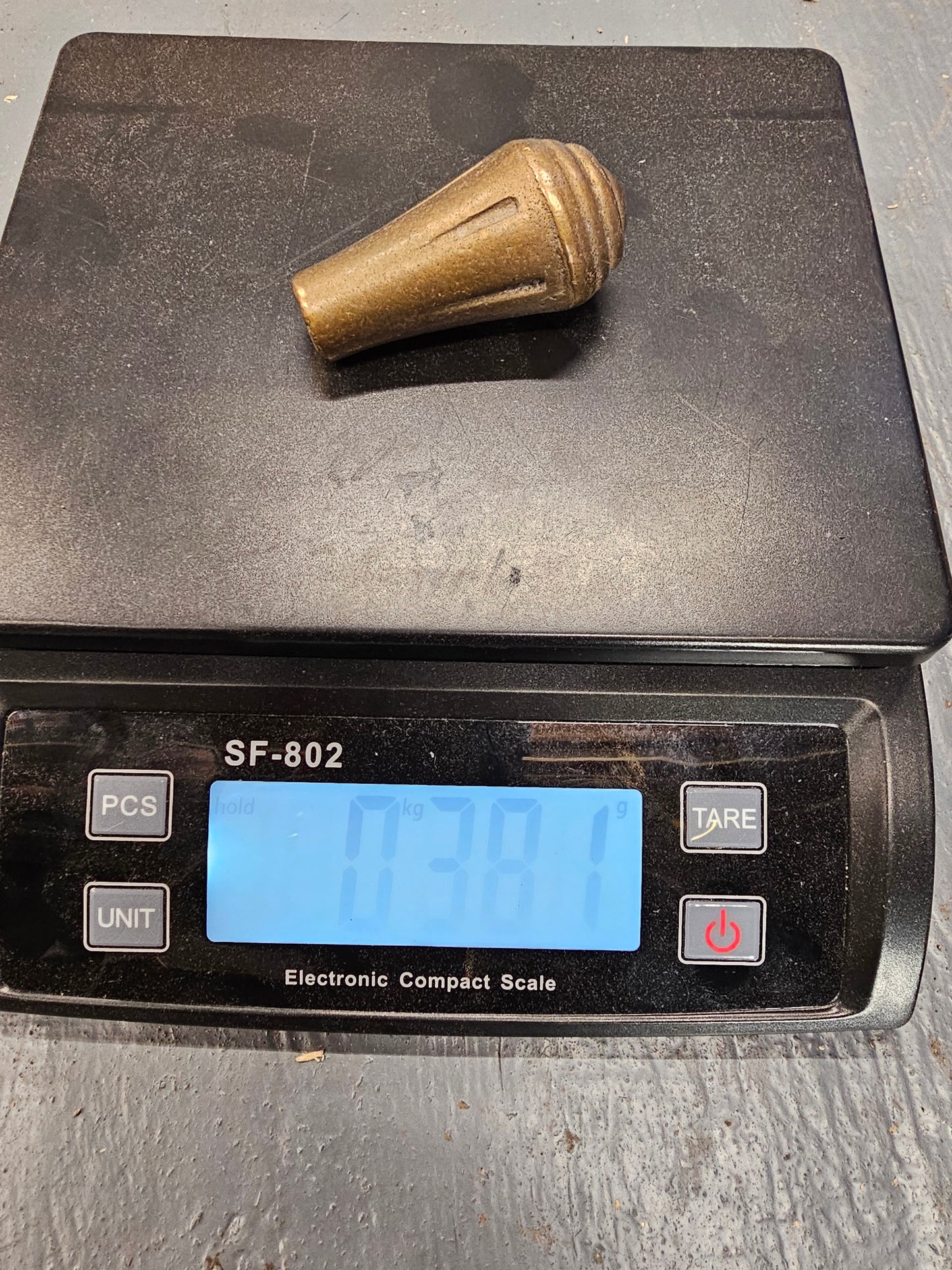 Brass knob. Would make a really nice shifter handle