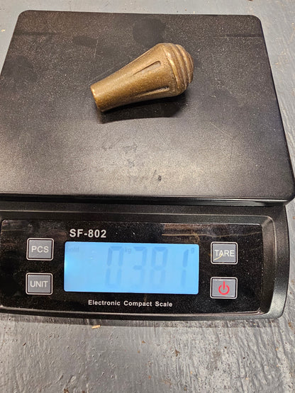 Brass knob. Would make a really nice shifter handle